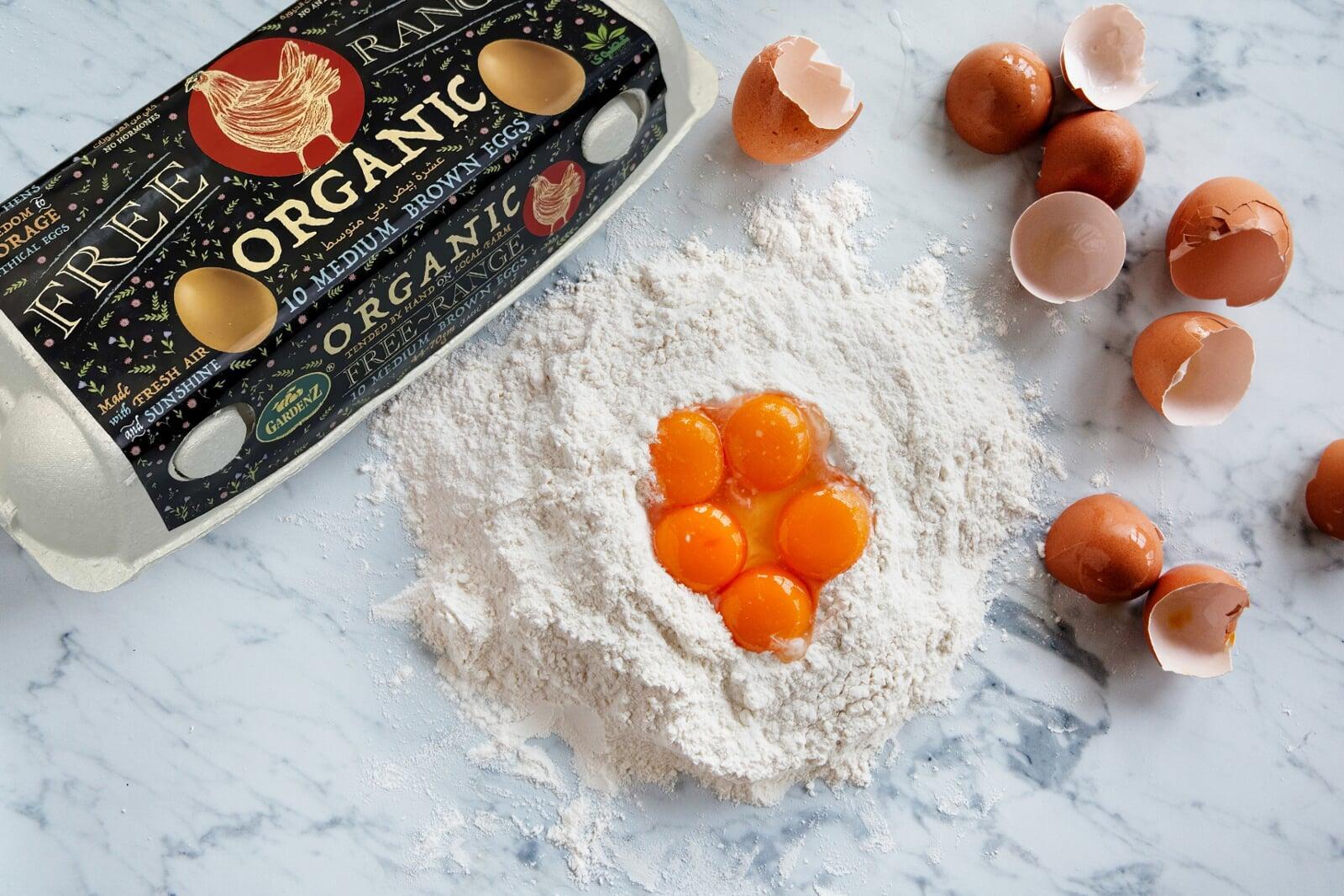 Golden yolk of Gardenz organic egg in frying pan